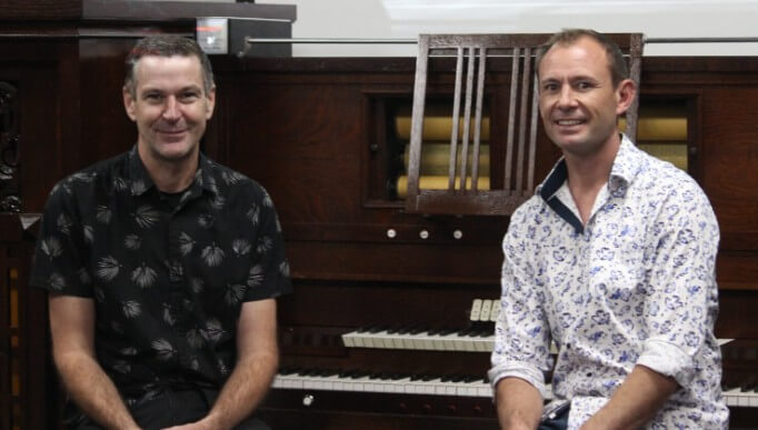 Kevin and Nathan seated at the Wurlitzer Model K